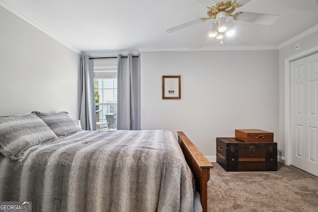 carpeted bedroom featuring a closet, crown molding, baseboards, and ceiling fan