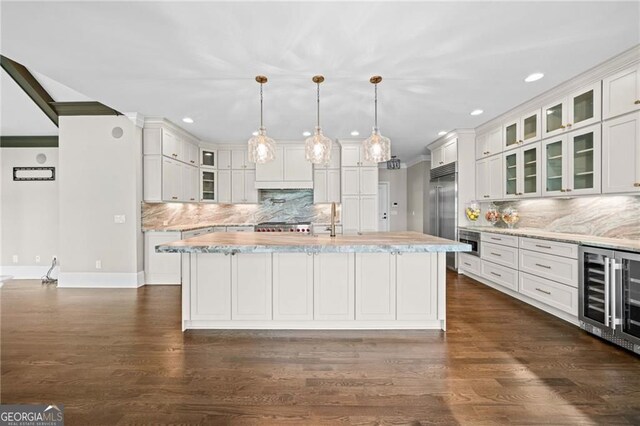 411 River Bluff Ln, Ball Ground, GA 30107 - kitchen featuring recessed lighting, a center island with sink, backsplash, and wine cooler