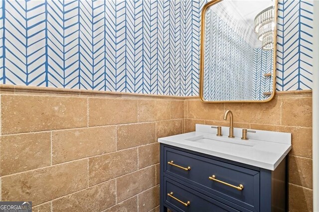 411 River Bluff Ln, Ball Ground, GA 30107 - bathroom featuring tile walls and vanity