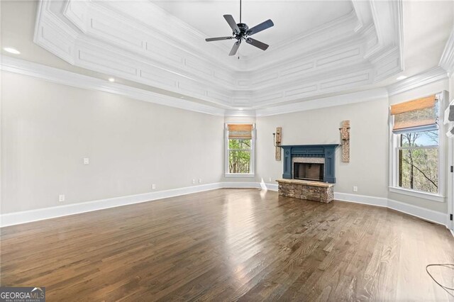 411 River Bluff Ln, Ball Ground, GA 30107 - unfurnished living room with baseboards, a ceiling fan, a fireplace, crown molding, and wood finished floors