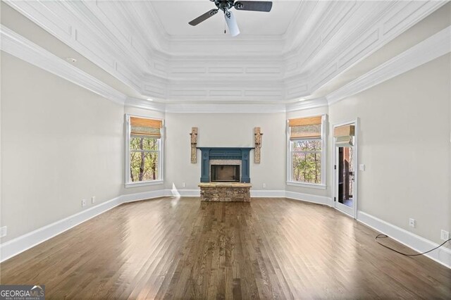 411 River Bluff Ln, Ball Ground, GA 30107 - unfurnished living room featuring wood finished floors, ceiling fan, a fireplace, and ornamental molding