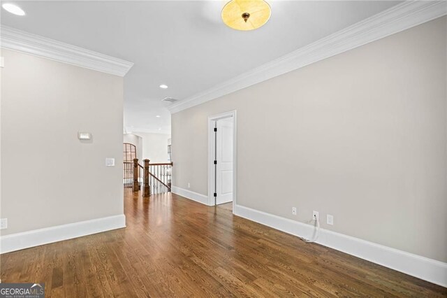 411 River Bluff Ln, Ball Ground, GA 30107 - unfurnished room with visible vents, baseboards, crown molding, recessed lighting, and wood finished floors