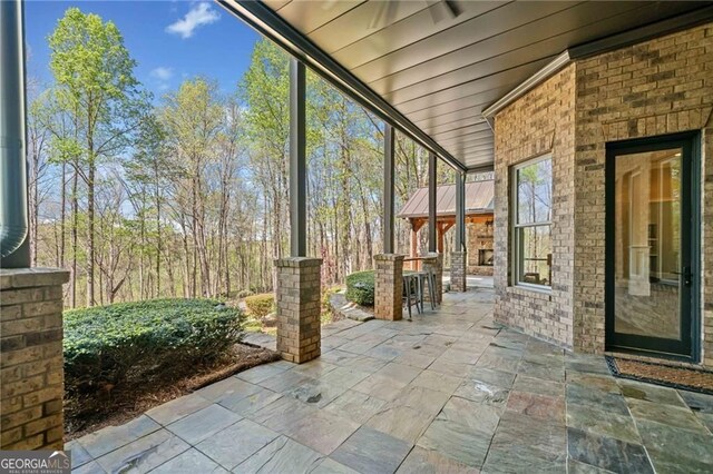 411 River Bluff Ln, Ball Ground, GA 30107 - view of unfurnished sunroom