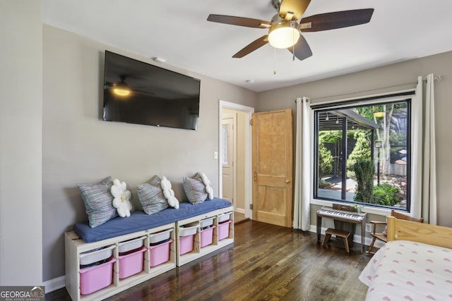 bedroom with wood finished floors, baseboards, and ceiling fan