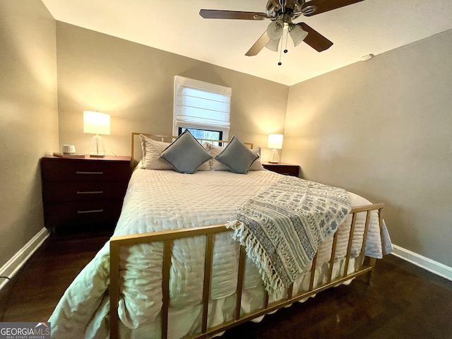 bedroom with baseboards, wood finished floors, and a ceiling fan