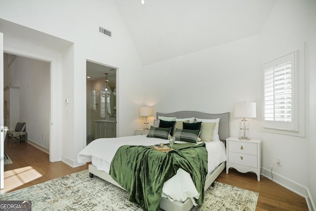 135 Channing Ln, Fayetteville, GA 30214 - bedroom with wood finished floors, high vaulted ceiling, and ensuite bath