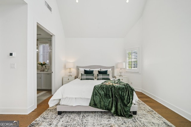 135 Channing Ln, Fayetteville, GA 30214 - bedroom featuring high vaulted ceiling, wood finished floors, and connected bathroom