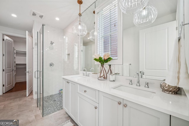 135 Channing Ln, Fayetteville, GA 30214 - bathroom featuring a stall shower, double vanity, a walk in closet, tile patterned flooring, and recessed lighting