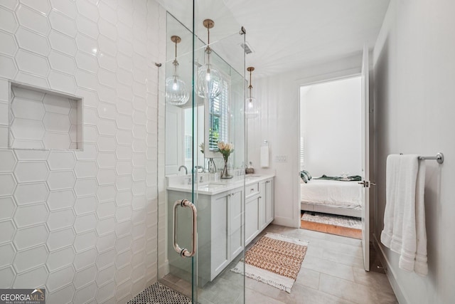 135 Channing Ln, Fayetteville, GA 30214 - bathroom with double vanity, a stall shower, tile patterned floors, and connected bathroom