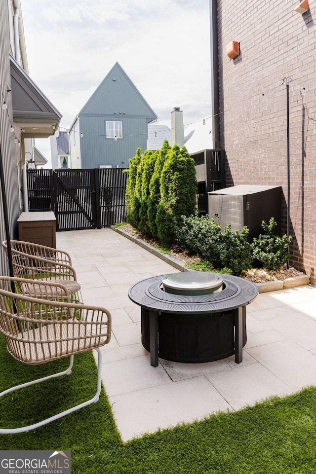 135 Channing Ln, Fayetteville, GA 30214 - view of patio featuring an outdoor fire pit