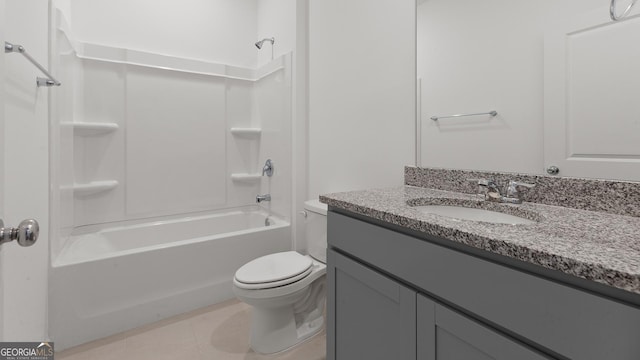 bathroom with tile patterned floors, washtub / shower combination, vanity, and toilet