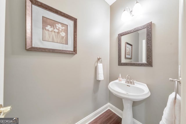 bathroom featuring baseboards and wood finished floors
