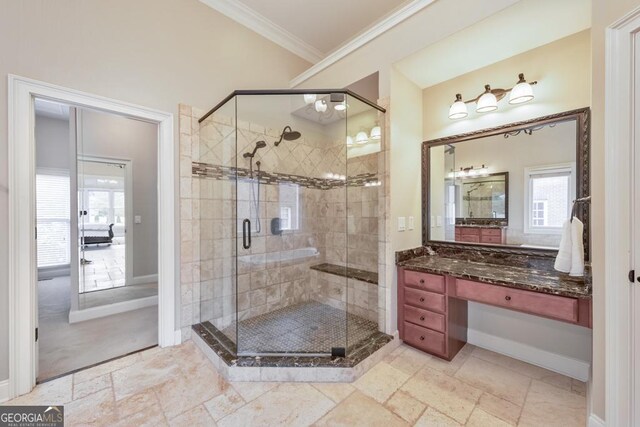 full bathroom featuring vanity, baseboards, ornamental molding, and a stall shower