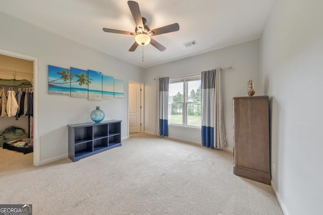 unfurnished bedroom featuring baseboards, carpet flooring, and visible vents