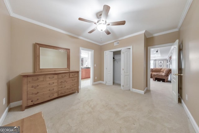 bedroom featuring visible vents, ornamental molding, a closet, and light colored carpet