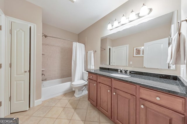 bathroom featuring vanity, tile patterned floors, shower / bath combo, and toilet