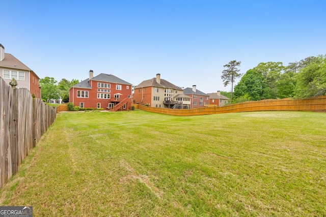view of yard featuring a fenced backyard