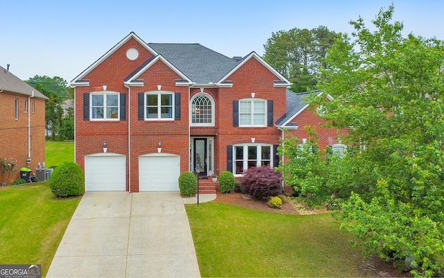 colonial inspired home with a front lawn, central AC, brick siding, concrete driveway, and an attached garage