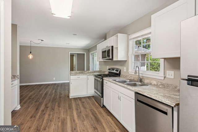 kitchen with a sink, dark wood finished floors, white cabinets, and stainless steel appliances