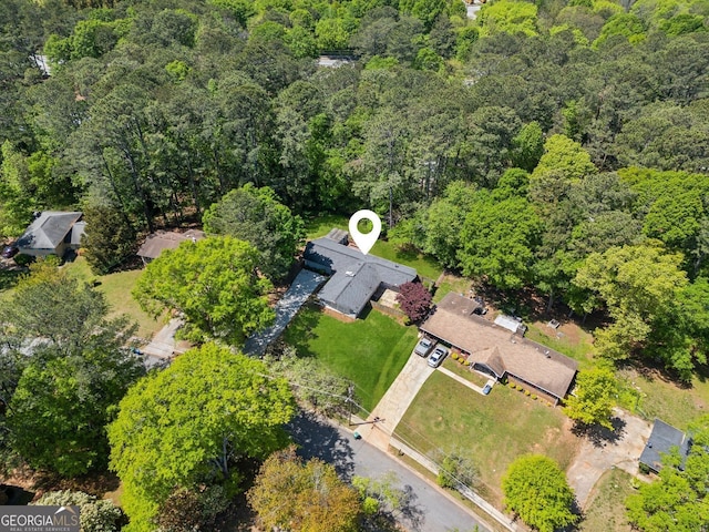 bird's eye view featuring a forest view