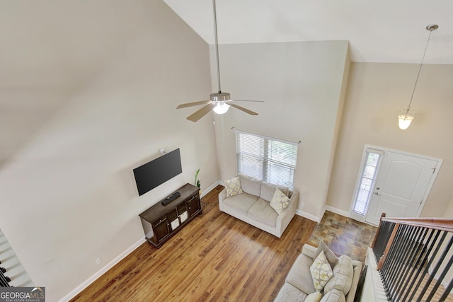 890 Crescent Ln, Griffin, GA 30224 - living area featuring light wood finished floors, a towering ceiling, and ceiling fan
