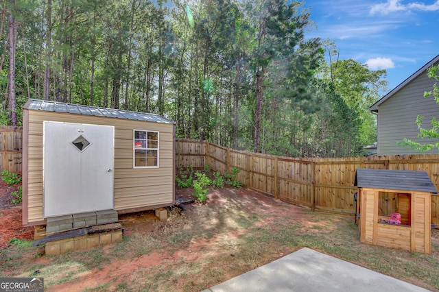 890 Crescent Ln, Griffin, GA 30224 - fenced backyard with a storage shed and a patio area