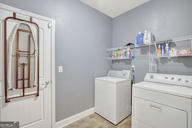 890 Crescent Ln, Griffin, GA 30224 - washroom featuring washer and dryer and baseboards