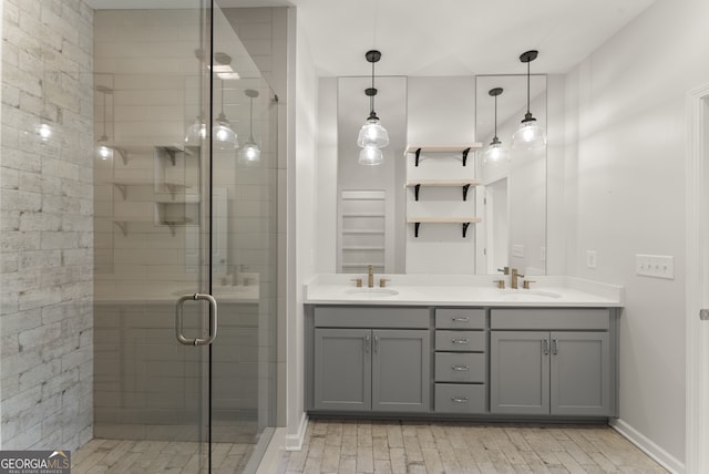 763 Hamilton Cir SE, Atlanta, GA 30312 - full bathroom with a shower stall, double vanity, baseboards, and a sink
