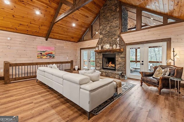 living room with wood ceiling, french doors, high vaulted ceiling, and wood finished floors