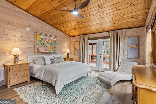 bedroom with wooden ceiling, wooden walls, french doors, access to outside, and lofted ceiling