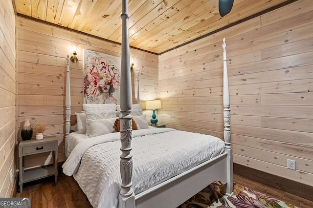 bedroom with wood walls, wooden ceiling, and wood finished floors