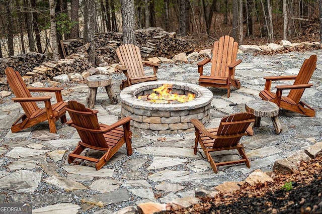 view of patio with a fire pit