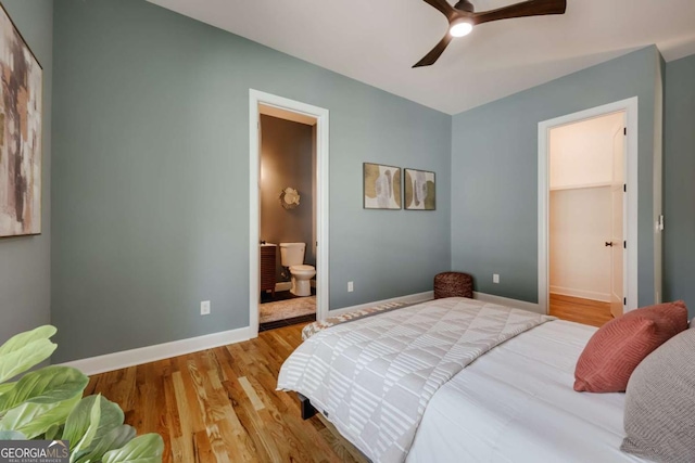 290 Hodgson Dr, Athens, GA 30606 - bedroom featuring baseboards, a ceiling fan, connected bathroom, and wood finished floors