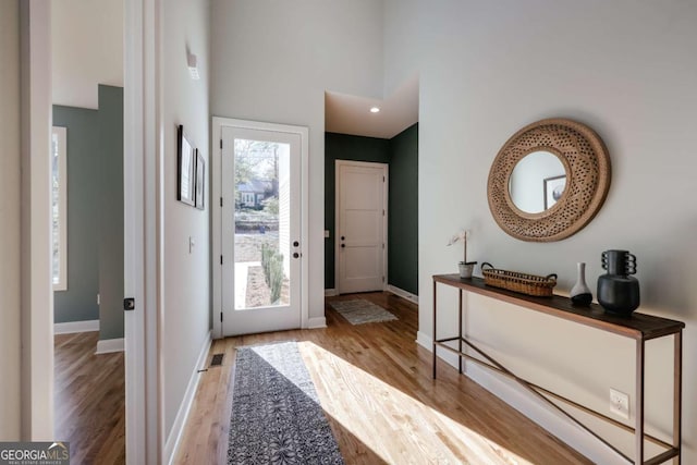 290 Hodgson Dr, Athens, GA 30606 - entrance foyer with visible vents, baseboards, a towering ceiling, and wood finished floors