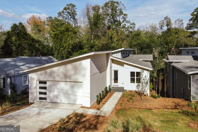 290 Hodgson Dr, Athens, GA 30606 - mid-century modern home featuring board and batten siding, a garage, and concrete driveway