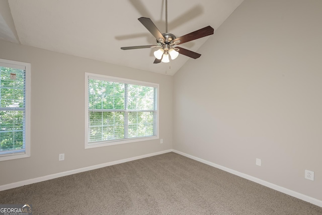 carpeted spare room with baseboards, a ceiling fan, and lofted ceiling