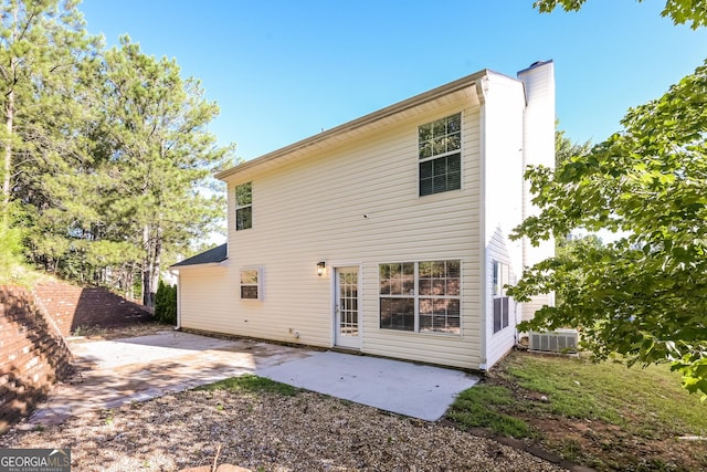back of property with a patio and cooling unit