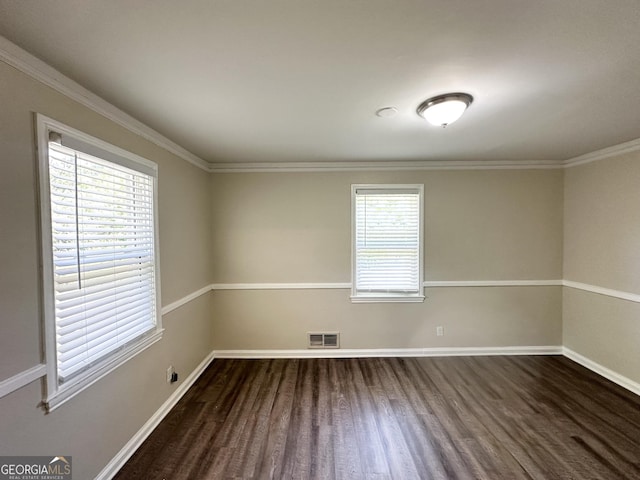 2361 Whites Mill Rd, Decatur, GA 30032 - empty room with visible vents, baseboards, ornamental molding, and dark wood-style floors