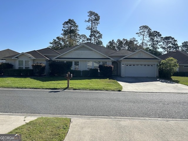 582 Eagle Blvd, Kingsland, GA 31548 - view of front of house with a garage, a front yard, and driveway