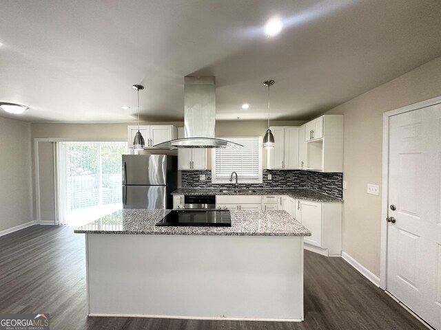 3191 Gay Dr, Decatur, GA 30032 - kitchen featuring island exhaust hood, dark wood-type flooring, freestanding refrigerator, and baseboards