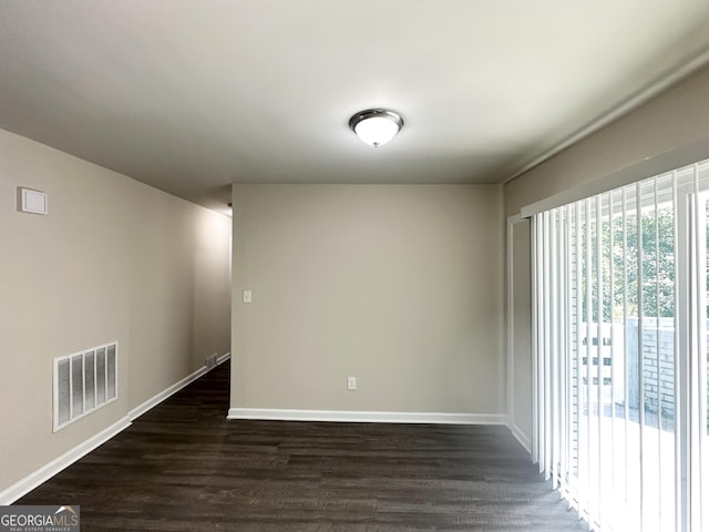 3191 Gay Dr, Decatur, GA 30032 - spare room featuring dark wood-style flooring, baseboards, and visible vents