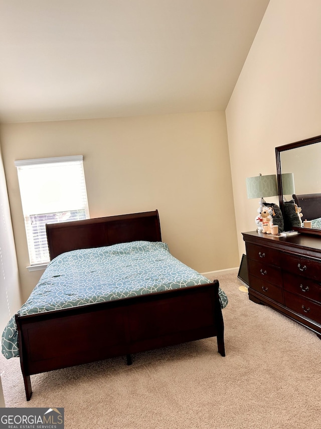 carpeted bedroom with baseboards