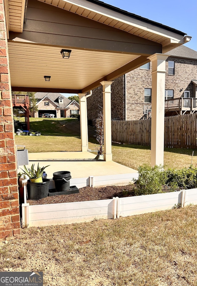 view of patio featuring fence