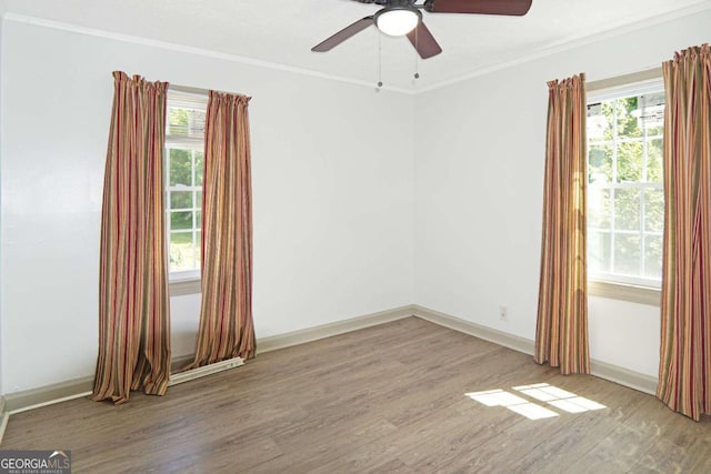 5024 Park Ave, Forest Park, GA 30297 - empty room with crown molding, wood finished floors, ceiling fan, and baseboards