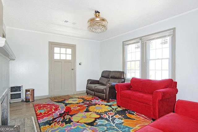 5024 Park Ave, Forest Park, GA 30297 - living room featuring crown molding, wood finished floors, and visible vents