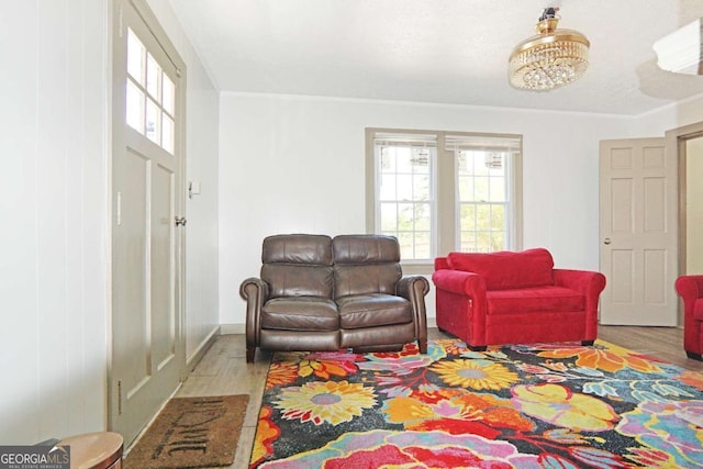 5024 Park Ave, Forest Park, GA 30297 - living area featuring crown molding, wood finished floors, and a healthy amount of sunlight