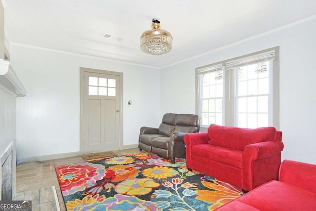 5024 Park Ave, Forest Park, GA 30297 - living area featuring ornamental molding, visible vents, baseboards, and wood finished floors