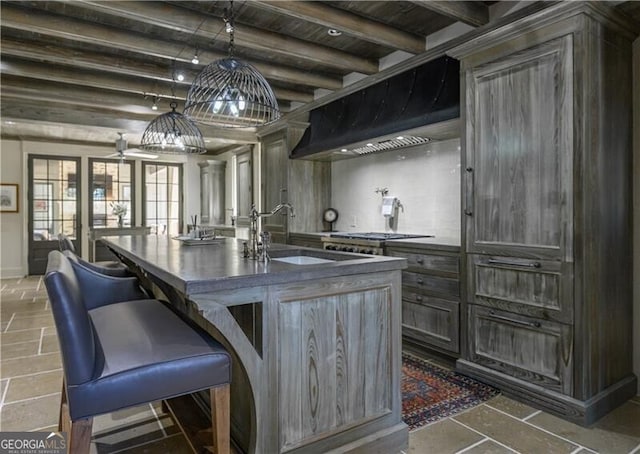 2979 Ridgewood Rd NW, Atlanta, GA 30327 - kitchen featuring custom exhaust hood, wooden ceiling, beam ceiling, dark countertops, and a sink
