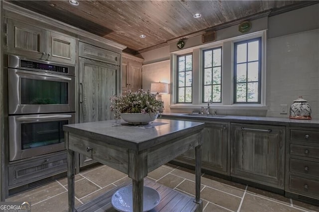 2979 Ridgewood Rd NW, Atlanta, GA 30327 - kitchen with stainless steel double oven, a sink, wooden ceiling, and recessed lighting