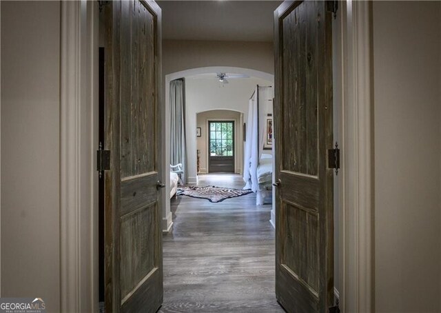 2979 Ridgewood Rd NW, Atlanta, GA 30327 - hallway featuring arched walkways and wood finished floors